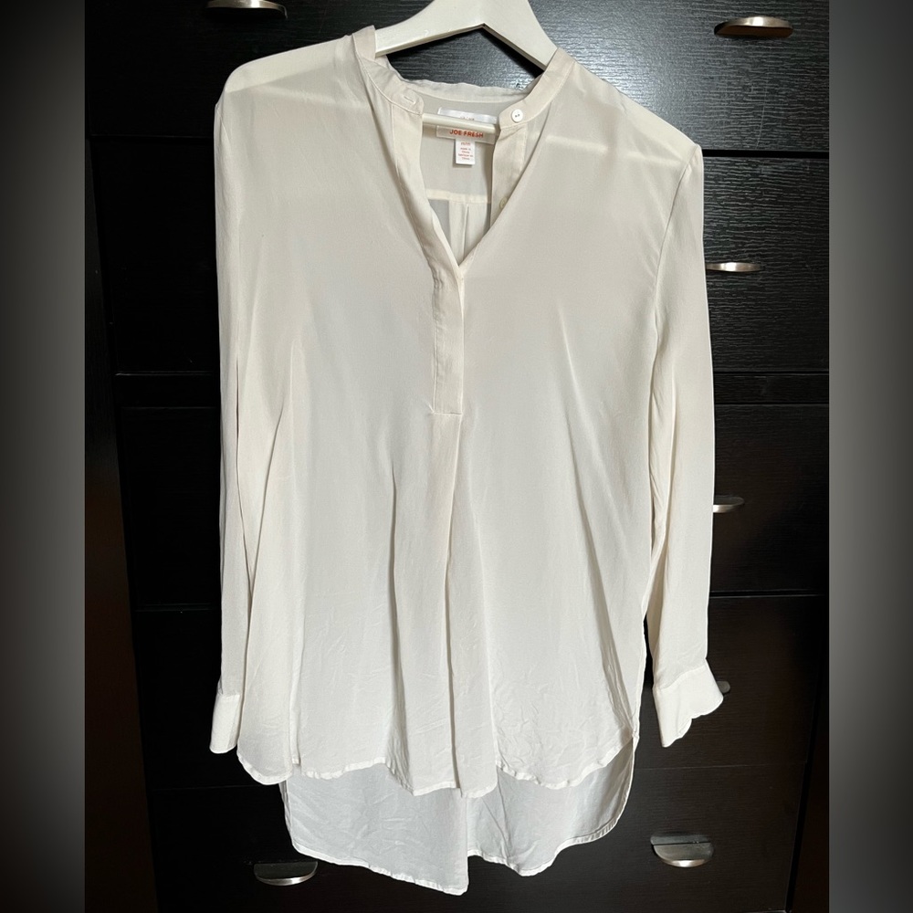 White silk blouse.
